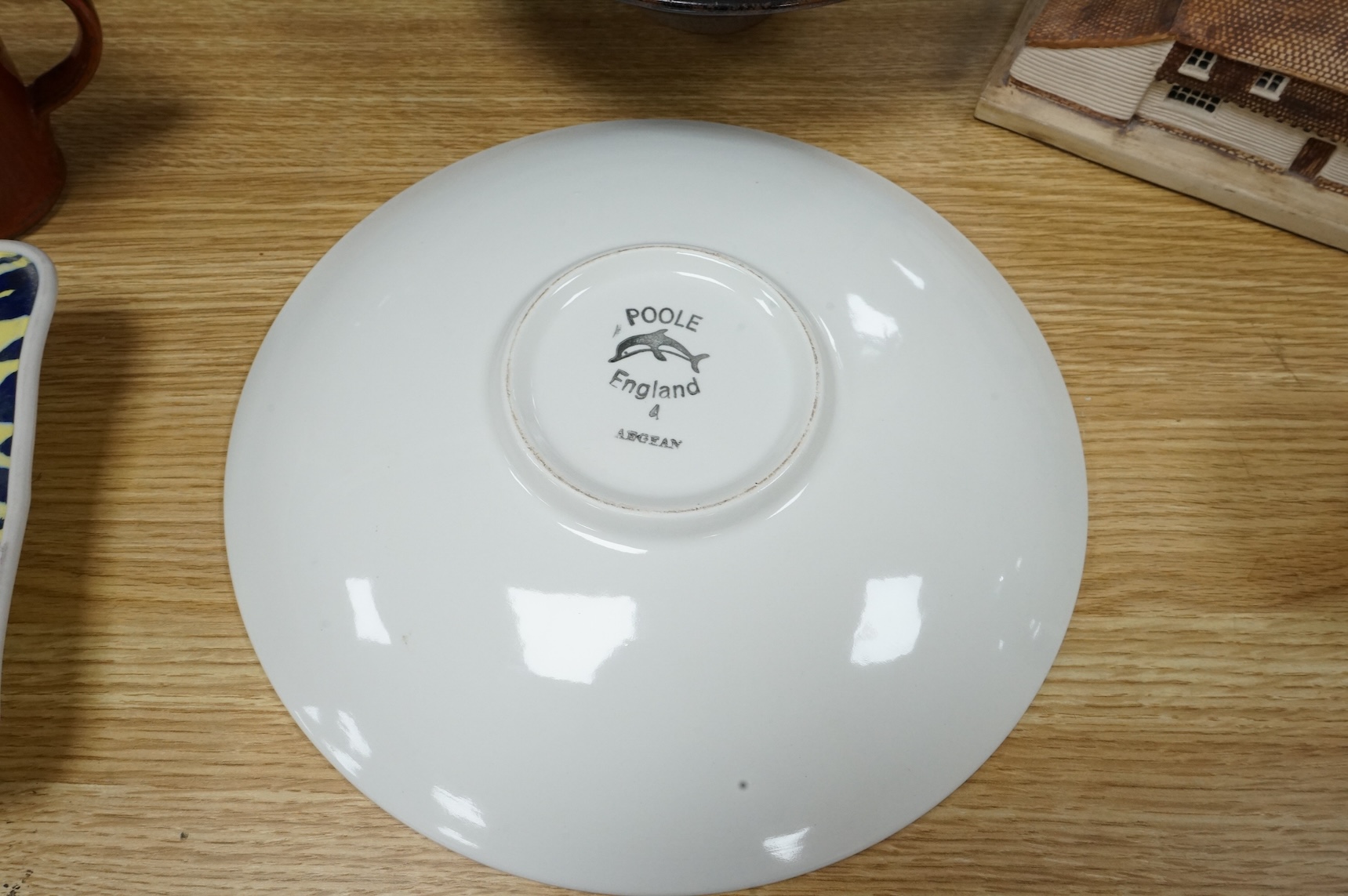A Poole pottery Aegean dish, together with a selection of Studio pottery bowls, dishes, jugs etc and a Donoghue / Rye cottage model, Poole dish 20cm diameter (14)